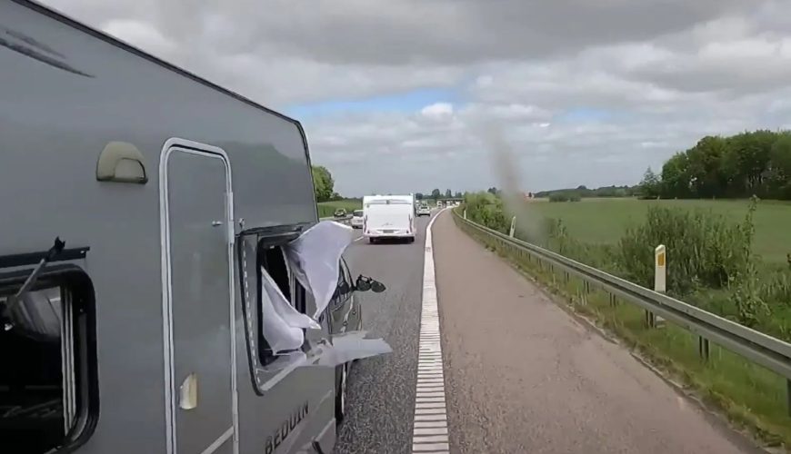 Watch terrifying moment caravan crashes into truck while trying to overtake it – but who’s to blame?