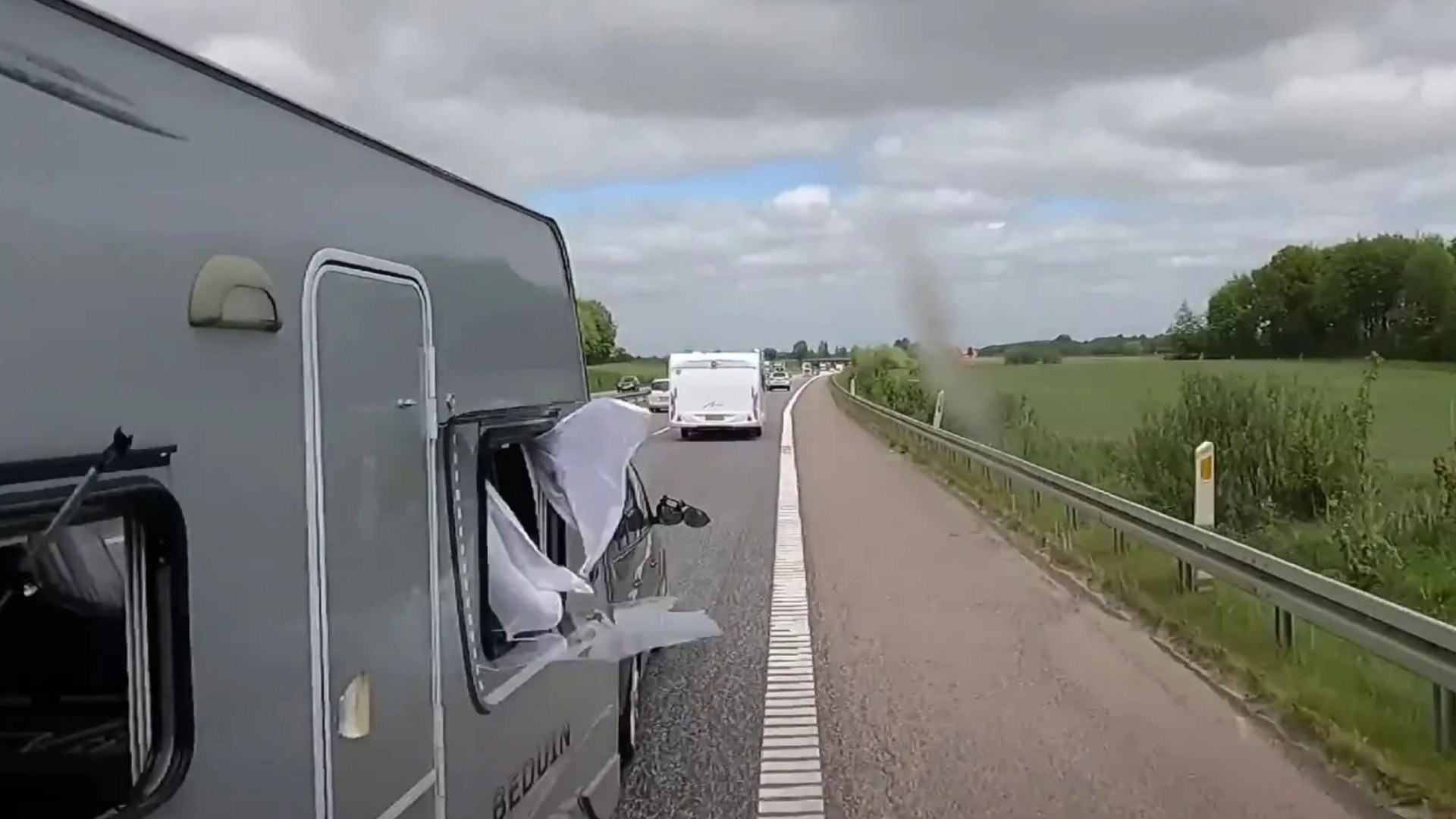 Watch terrifying moment caravan crashes into truck while trying to overtake it – but who’s to blame?